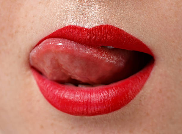 istock Tongue out woman face 628596510