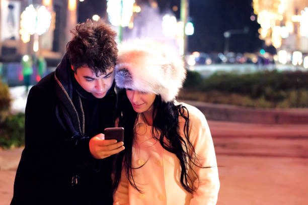 istock Couple looking at smart phone 628602276