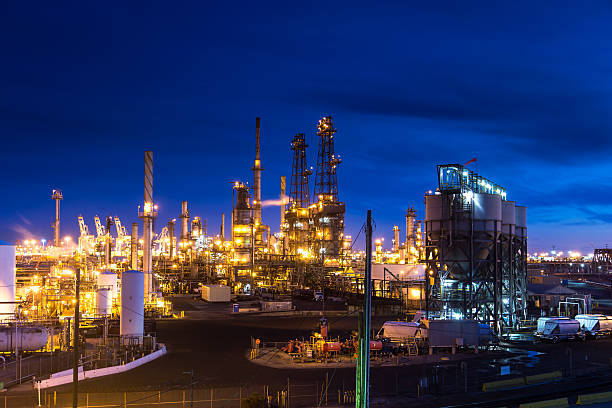 istock Oil Refinery Lit Up at Night 628602340