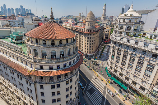 Argentina Buenos Aires - The corner of the streets : Avenida Roque Sáenz Peña - Florida and Bartolomé Mitre. On the left: First National Bank of Boston, Middle: La Equitativa del Plata building and on the right: Miguel Bencich Building