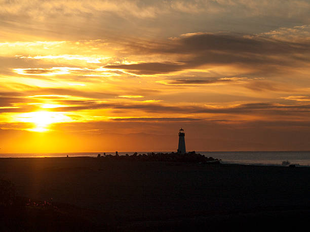 istock Silhouette of Lighthouse in the Morning Sun 628603052