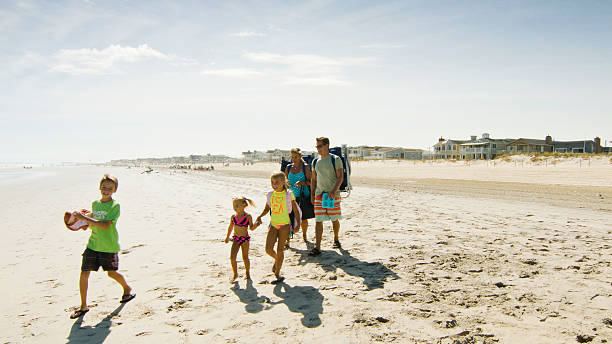 istock Family Arriving at Beach 628606764