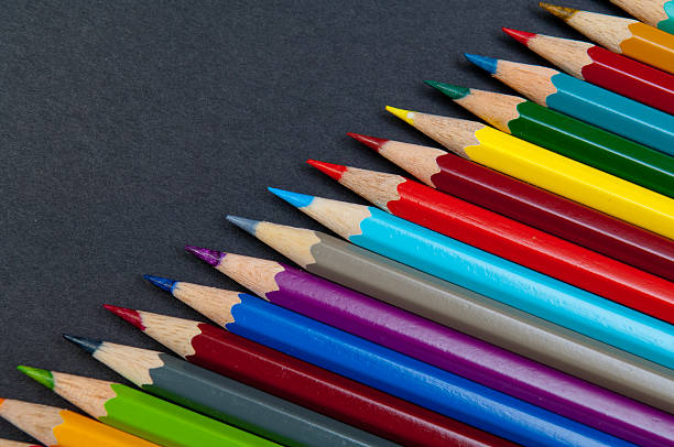 istock Color pencils isolated on black background close up 628608298