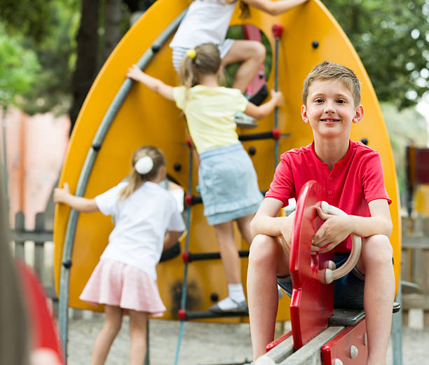 istock cheerful boy on children's playground 628610530