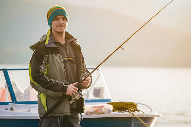 istock young man fishing 628610764