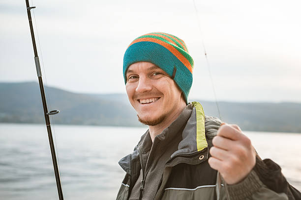 istock young man fishing 628611128