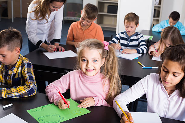 istock Children of elementary age having class of art 628611160