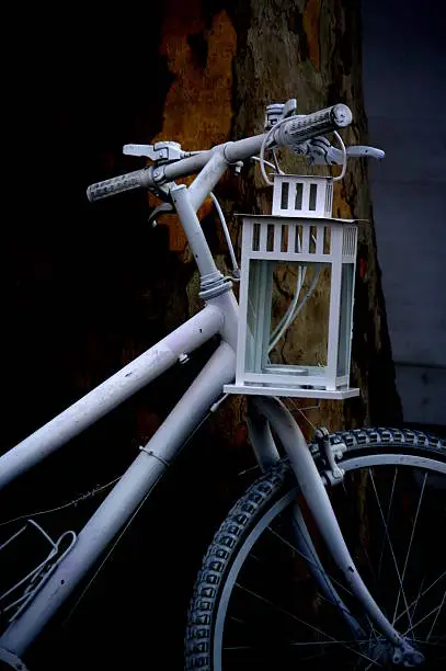 White bicycle with lantern