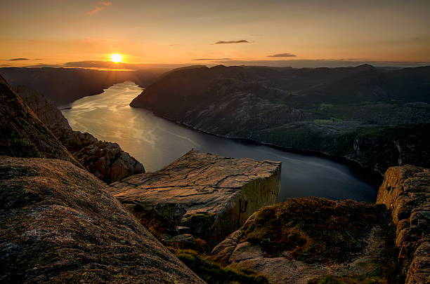 Preikestolen sunset Sunset on Preikestolen over Lysefjorden, Norway lysefjorden stock pictures, royalty-free photos & images