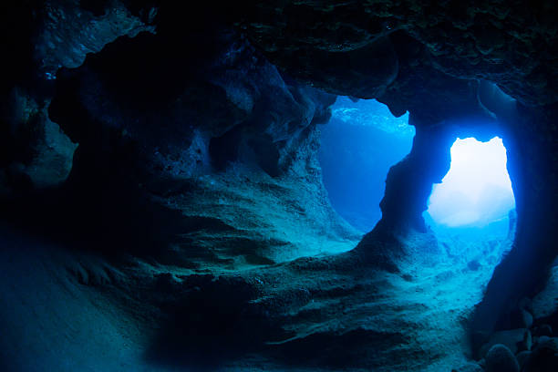 Underwater Cave Sunbeam into the dark cave.Miyakojima-island,Okinawa,Japan. miyakojima island photos stock pictures, royalty-free photos & images