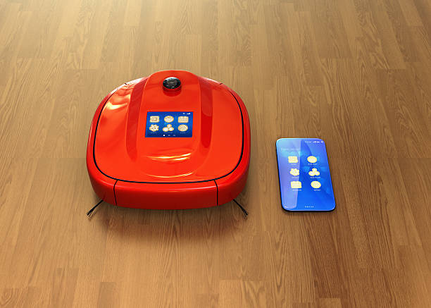 istock Red robotic vacuum cleaner and smartphone 628618548