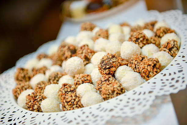 Cake balls, coconut, hazelnuts in natural light