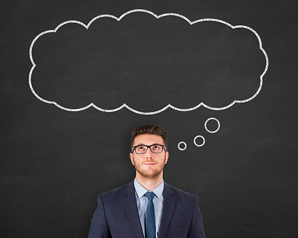 istock Business Person standing next to thought bubble drawn over head 628618820