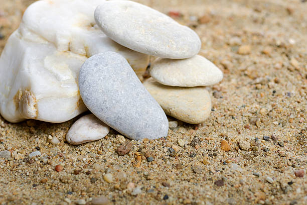 istock Stones on the sand in natural light 628618874