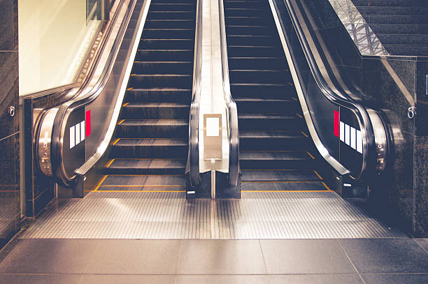 istock Empty escalator stairs in the public building 628619250