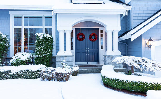 Walkway to home decorated for the winter holidays stock photo