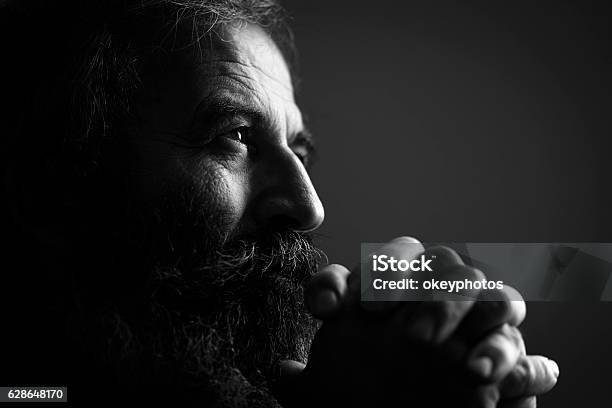 Closeup Of Man Praying Stock Photo - Download Image Now - Black And White, Portrait, Men