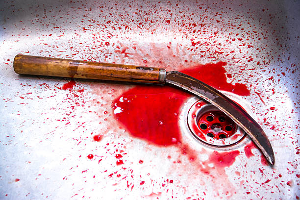 Sickle with blood at sink background,Kill concept,Murder concept