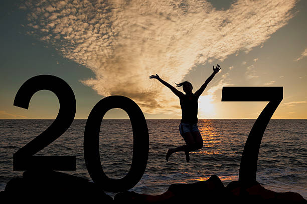 istock Person silhouette jumping in New Year 2017 628648760