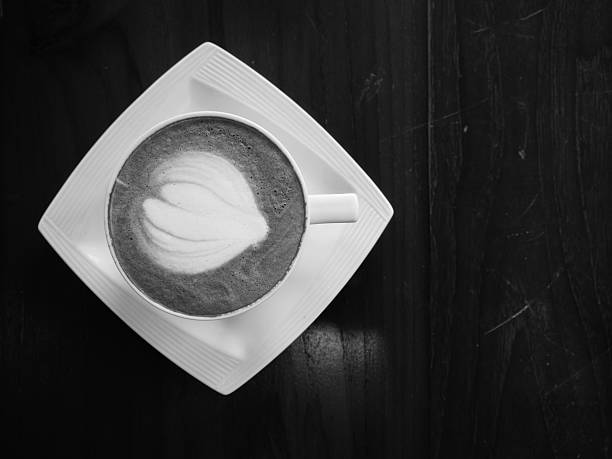 coffee on the wooden table. Black and White picture