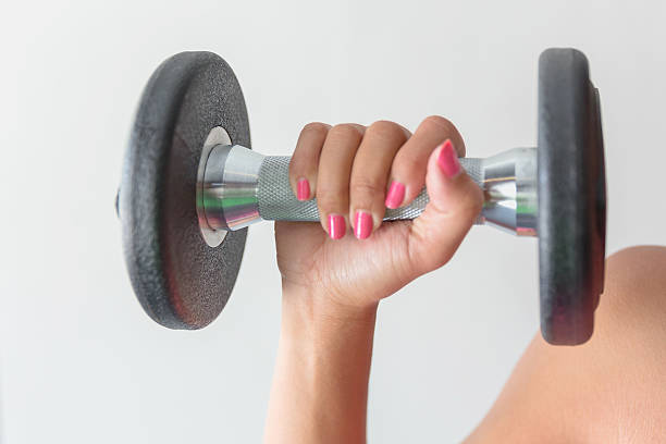 Woman exercising with dumbbell