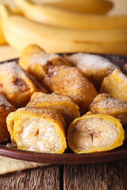 istock Pisang goreng fried bananas in batter on a plate macro 628659296