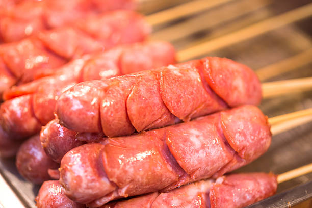 istock hot dog in bamboo stick for barbecue 628659876