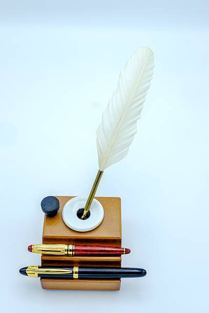 istock Feather Pen and fountain pen in a inkwell 628662050
