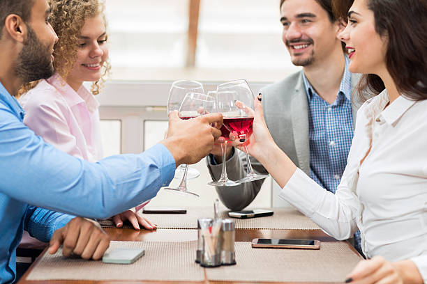 istock Young Business People Group Sitting At Cafe Table Toasting, Hold 628664082