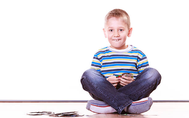 istock Little boys have fun and play cards. 628664142