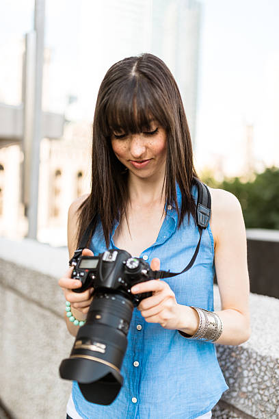 istock brunette tourist with a camera in Montreal - Canada 628664648