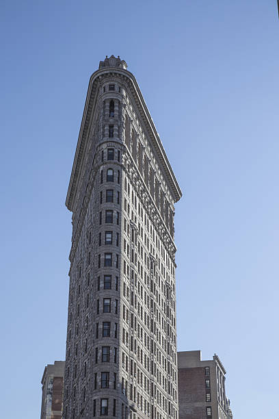 istock Flat Iron building facade in new york 628664670