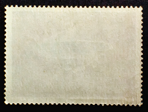 An old blank postcard from the USA bearing a one cent printed stamp with an illustration of Martha Washington (1731-1802), the wife of George Washington, the first president of the United States. Probably early-mid 20th century.