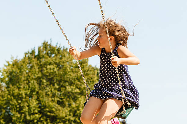 istock Playful crazy girl on swing. 628664776
