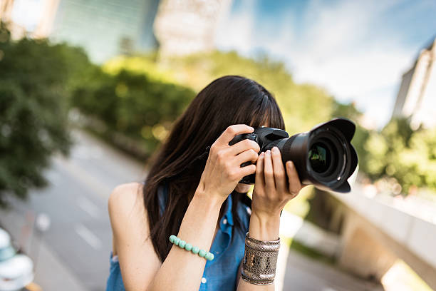istock brunette tourist with a camera in Montreal - Canada 628664786
