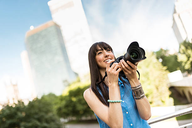 istock brunette tourist with a camera in Montreal - Canada 628664838