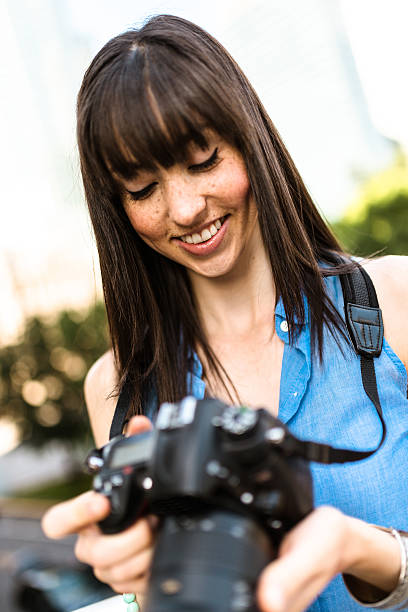 istock brunette tourist with a camera in Montreal - Canada 628664936