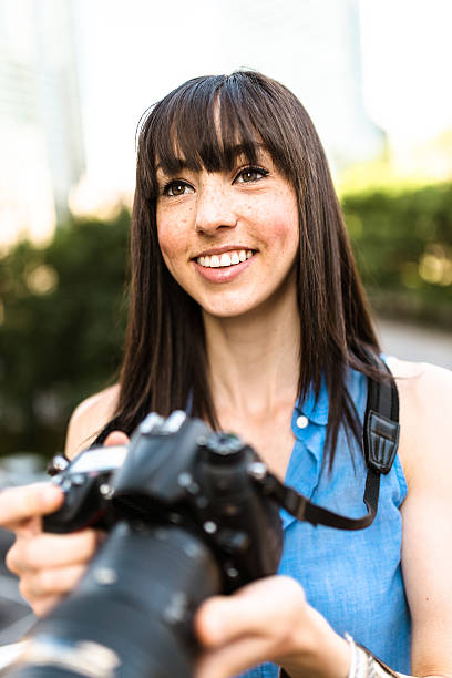 istock brunette tourist with a camera in Montreal - Canada 628665016