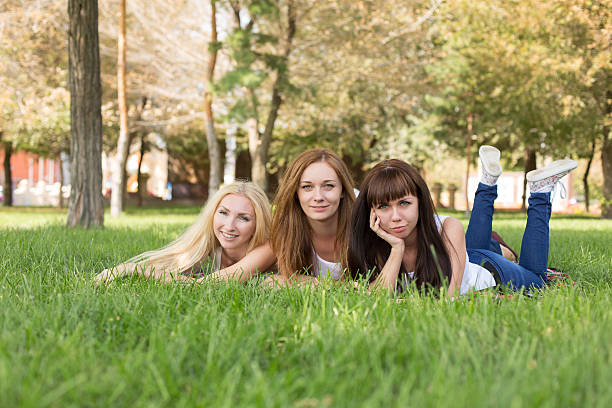 istock beautiful young woman posing while lying on the plaid in 628694502