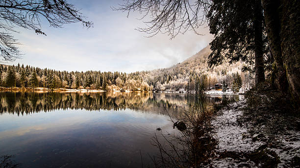istock first snow at the mountain lake 628694654
