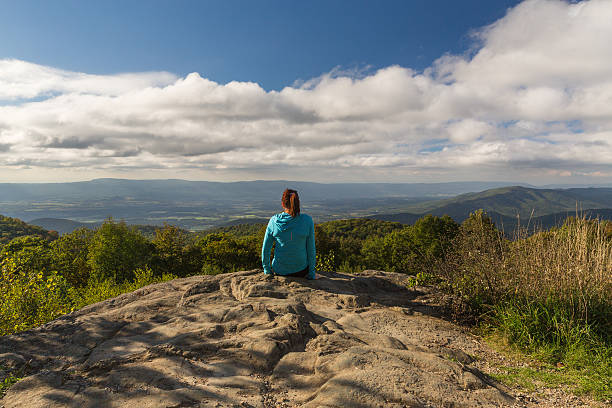istock woman over looking the Blue Ridge Mountains 628695966