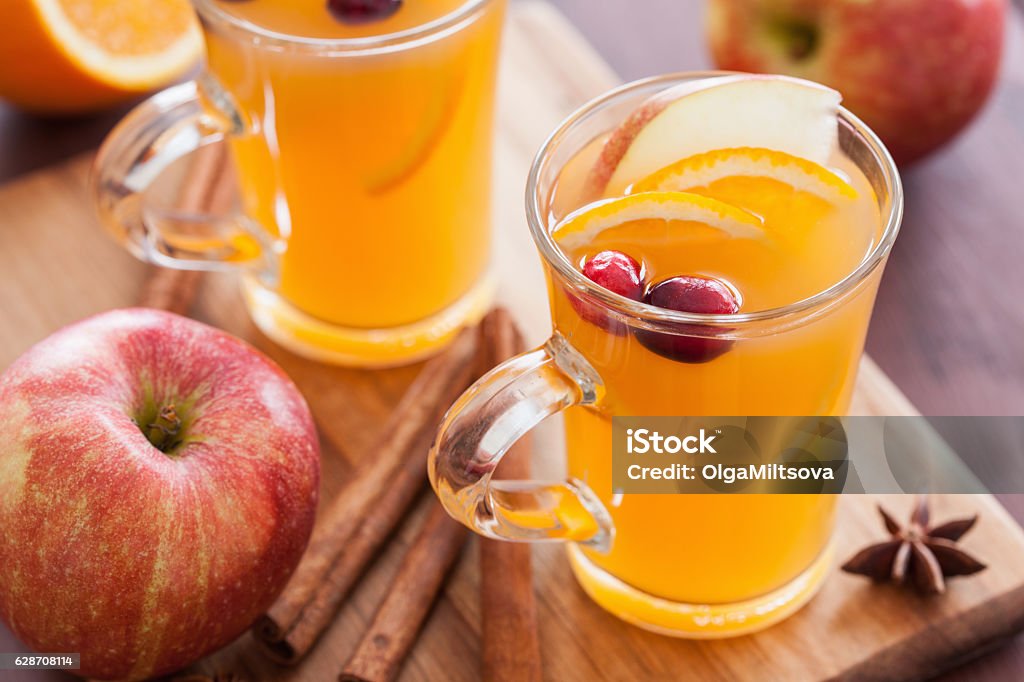 hot apple orange cider with cinnamon spice warming drink Apple - Fruit Stock Photo