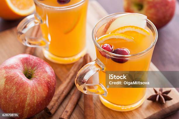 Hot Apple Orange Cider With Cinnamon Spice Warming Drink Stock Photo - Download Image Now