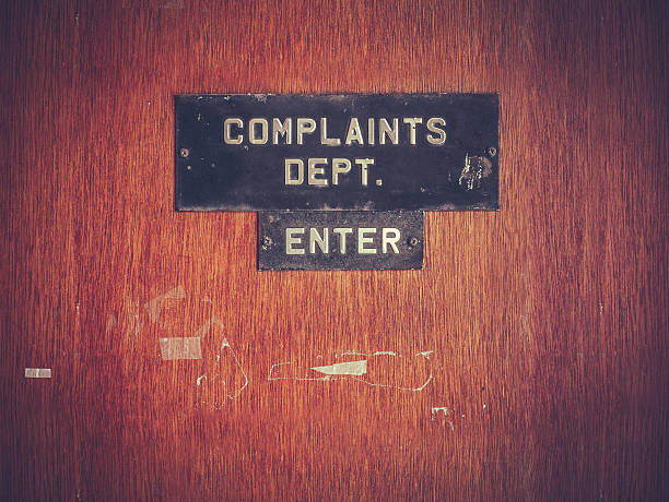Retro Grunge Complaints Dept Door stock photo