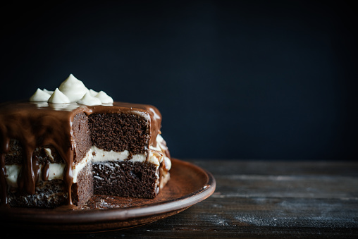 chocolate cake, syrup, dark background, glaze,pastry