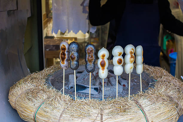 istock Japanese dessert rice balls griiled on fire. 628712514