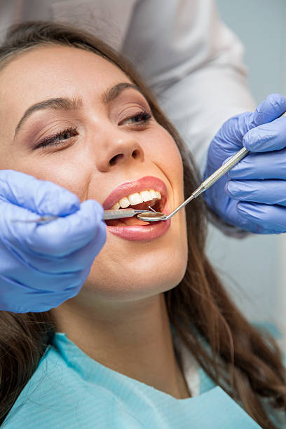 istock Female patient open her mouth during treatment 628713022
