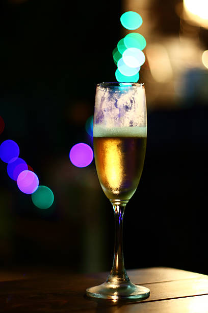 istock Champagne glasses on sparkling background 628737950