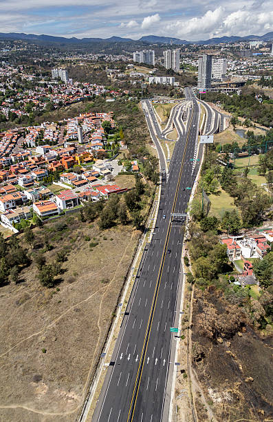 istock aerial view of highway and town 628746094