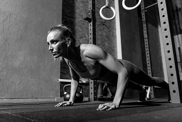 istock Serious thoughtful woman working out in the gym 628746410
